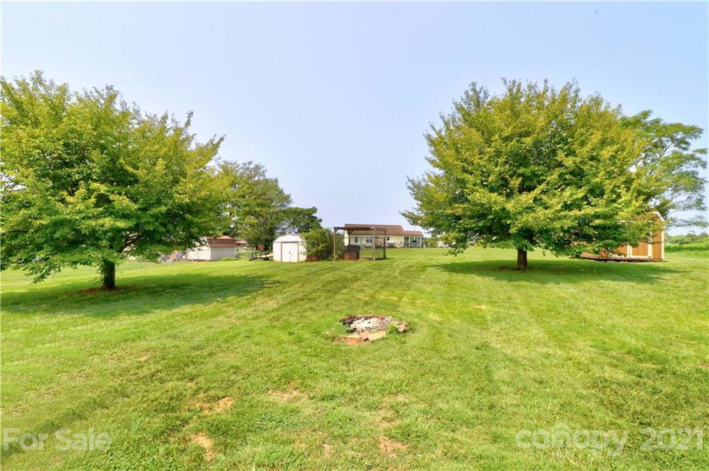 1045 Tabor Road Olin, NC 28660 - Photo 31 of 44 a view of a trees with a big yard