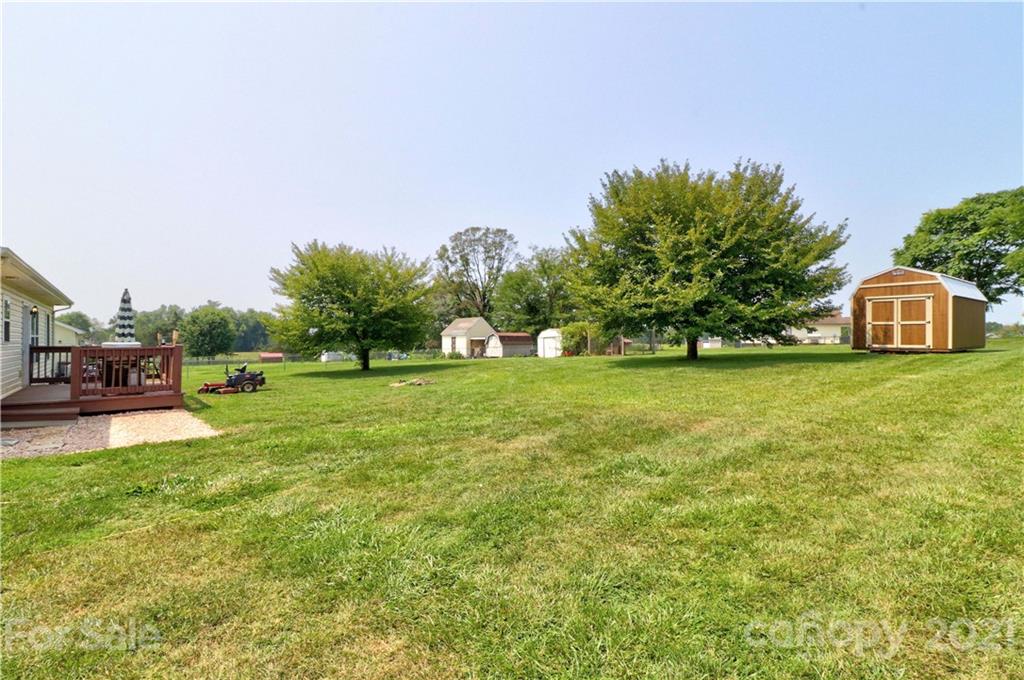 1045 Tabor Road Olin, NC 28660 - Photo 32 of 44 a view of a house with a big yard