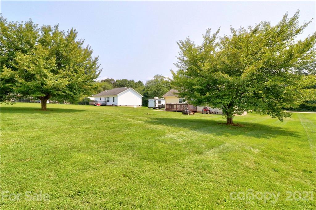 1045 Tabor Road Olin, NC 28660 - Photo 34 of 44 a view of yard with tree and green space