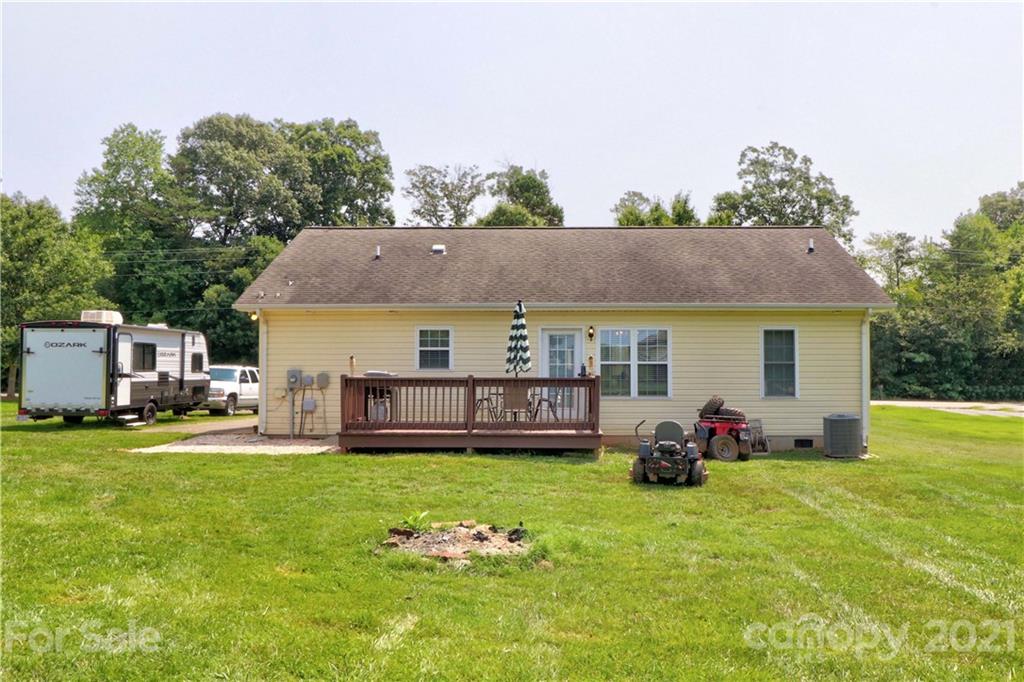 1045 Tabor Road Olin, NC 28660 - Photo 39 of 44 a view of a house with backyard and sitting area