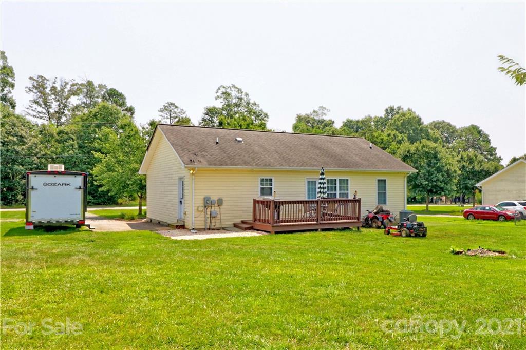 1045 Tabor Road Olin, NC 28660 - Photo 40 of 44 a view of a house with a yard and sitting area