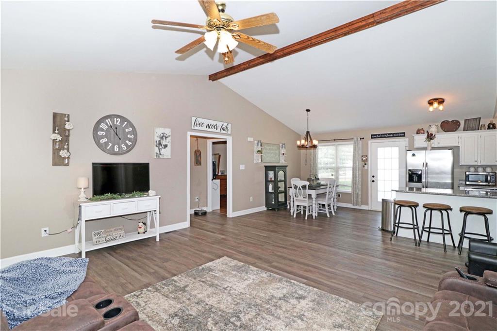 1045 Tabor Road Olin, NC 28660 - Photo 5 of 44 a living room with furniture and a flat screen tv