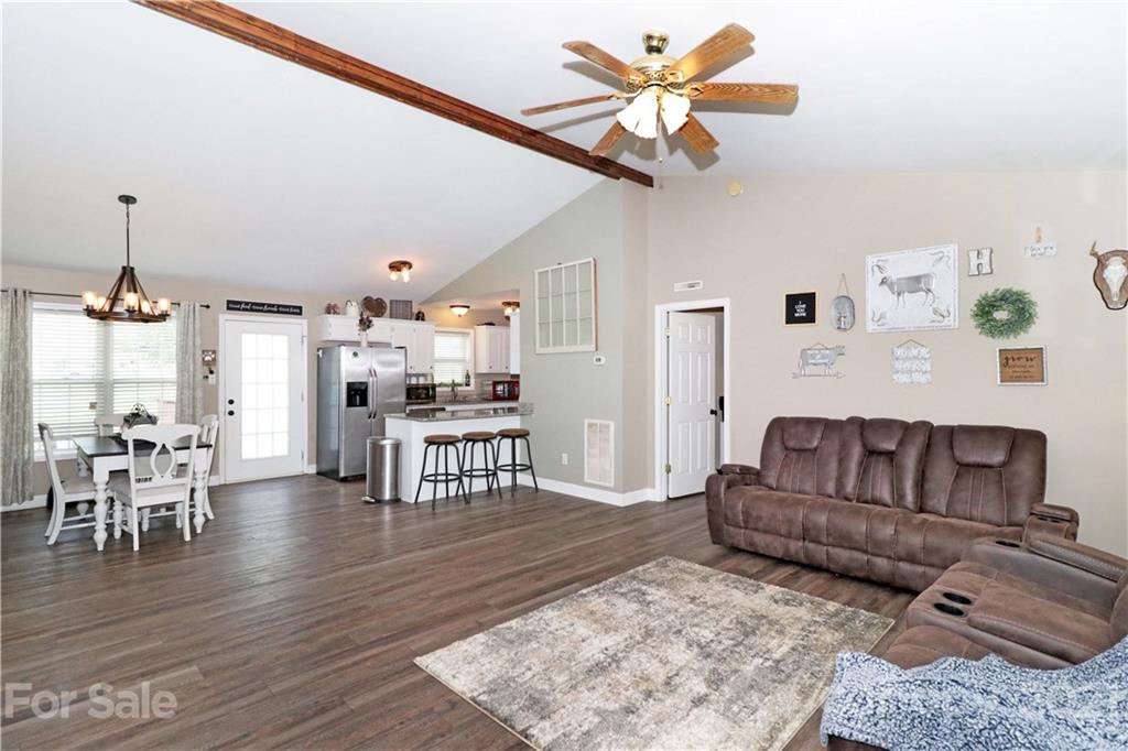 1045 Tabor Road Olin, NC 28660 - Photo 6 of 44 a living room with furniture and a wooden floor