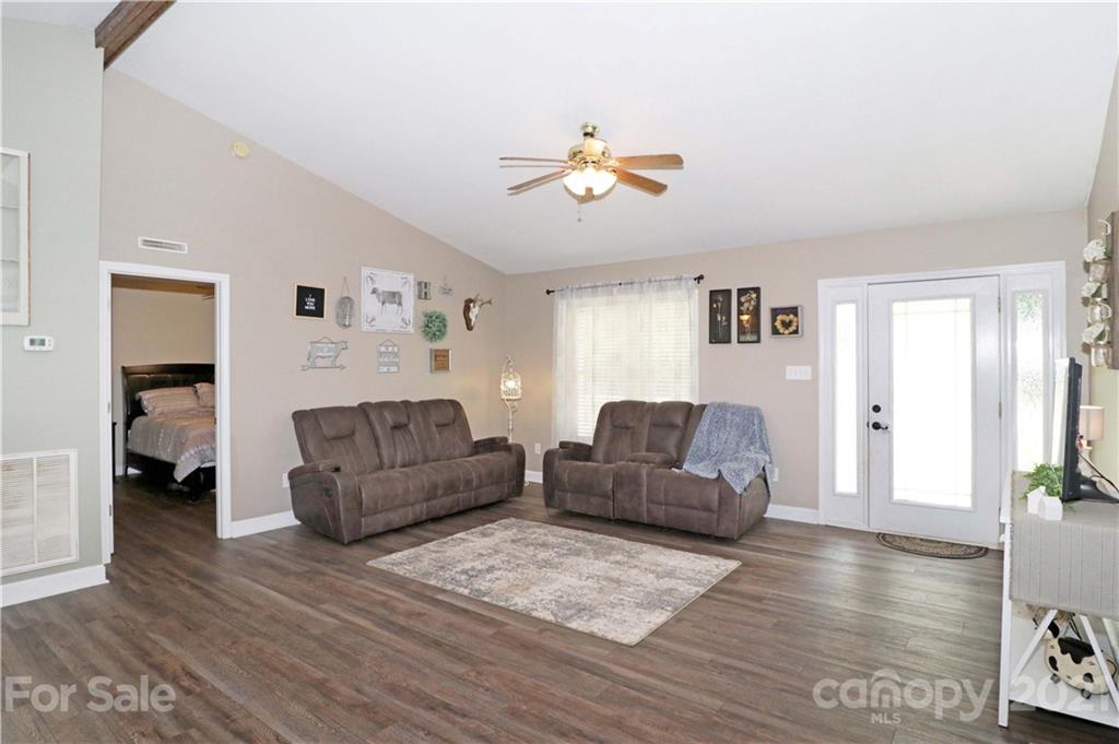 1045 Tabor Road Olin, NC 28660 - Photo 7 of 44 a living room with furniture and a wooden floor