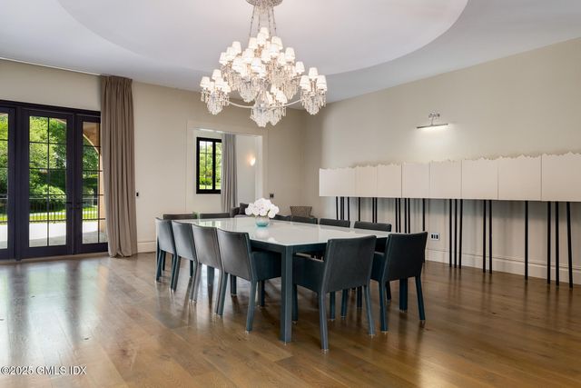 a view of a bedroom with a bed and a window