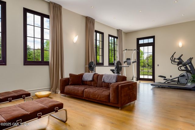 a bedroom with a bed a couch and a window