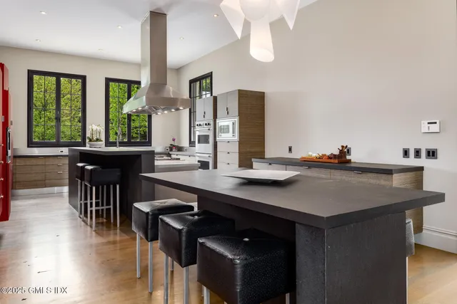 a view of a bedroom with a bed and a window