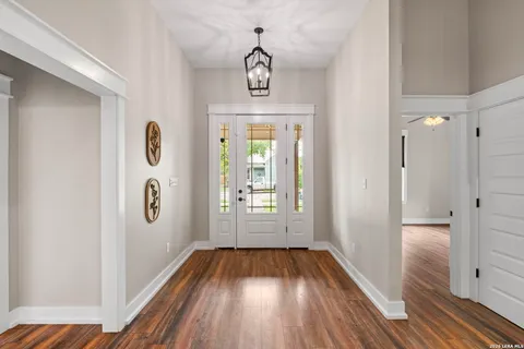 a view of an entryway with wooden floor