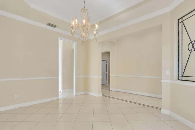 a kitchen with a refrigerator and a sink