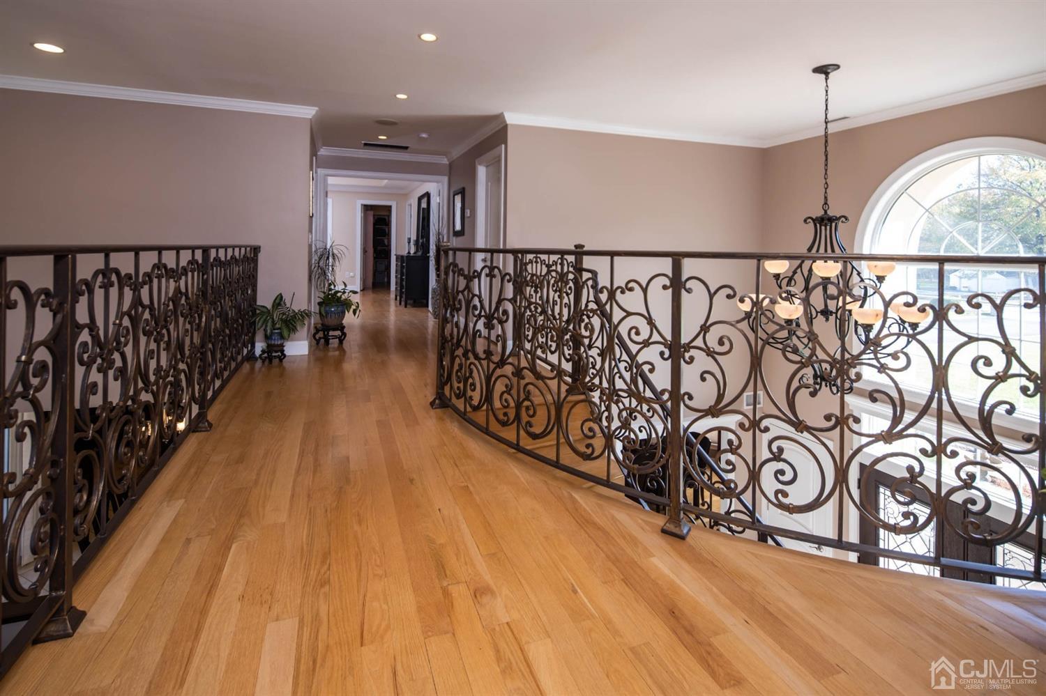 329 Pleasant Valley Road Old Bridge, NJ 08857 - Photo 23 of 75 Upstairs walk way overlooking entrance and family room. Wrought Iron banisters.
