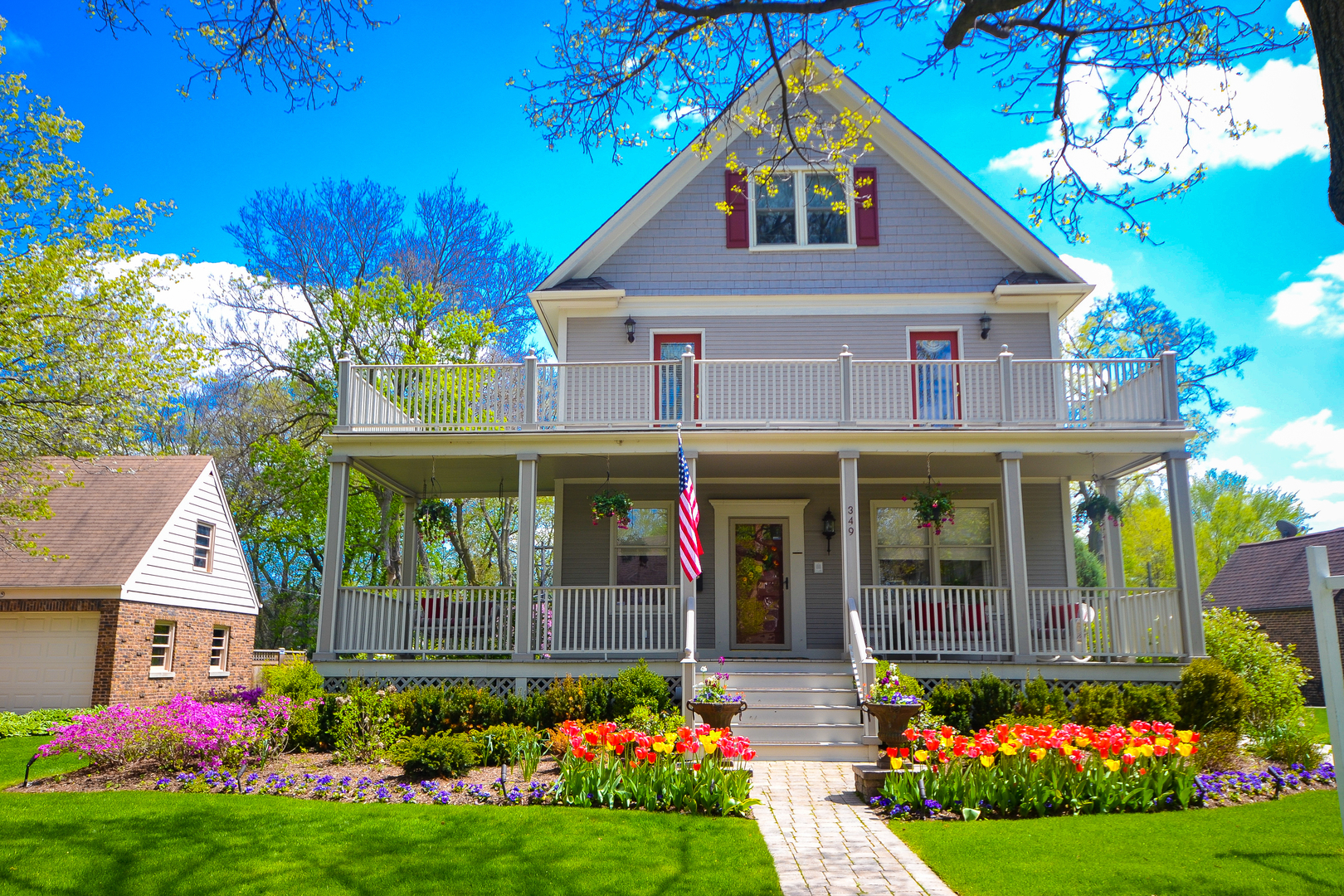 349 Downing Road Riverside, IL 60546 - Photo 1 of 47 a front view of a house with garden