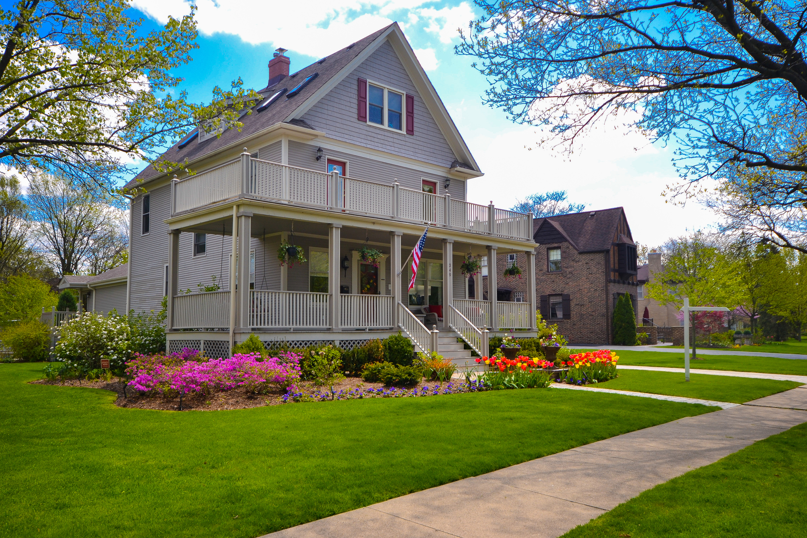 349 Downing Road Riverside, IL 60546 - Photo 4 of 47 a front view of a house with a big yard and potted plants