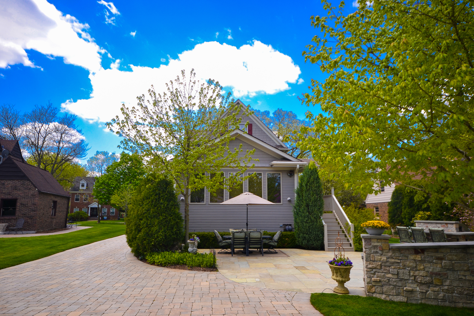 349 Downing Road Riverside, IL 60546 - Photo 41 of 47 a front view of a house with a yard and potted plants