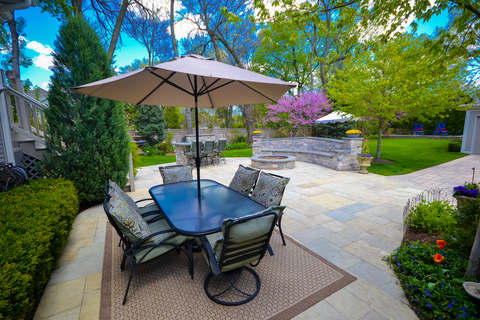 349 Downing Road Riverside, IL 60546 - Photo 42 of 47 a backyard of a house with table and chairs
