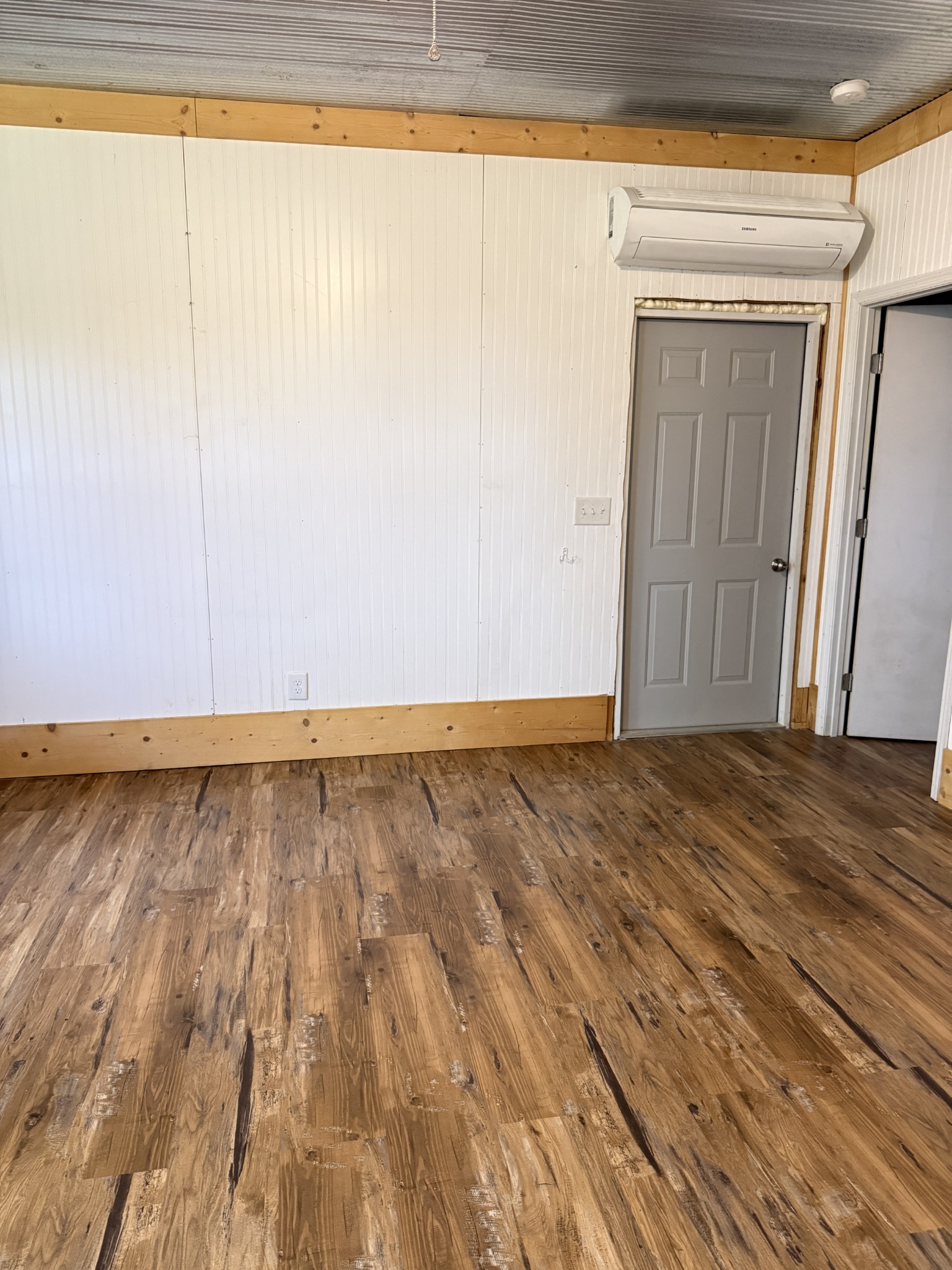 855 Lick Creek Road Hartsville, TN 37074 - Photo 27 of 76 a view of an empty room and wooden floor and door