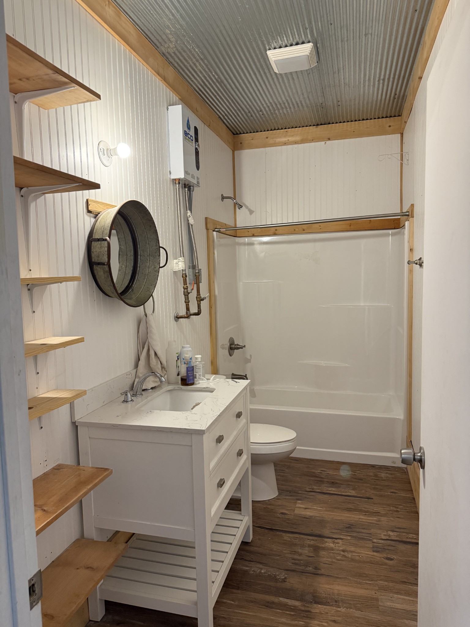 855 Lick Creek Road Hartsville, TN 37074 - Photo 28 of 76 a bathroom with a sink a toilet and shower