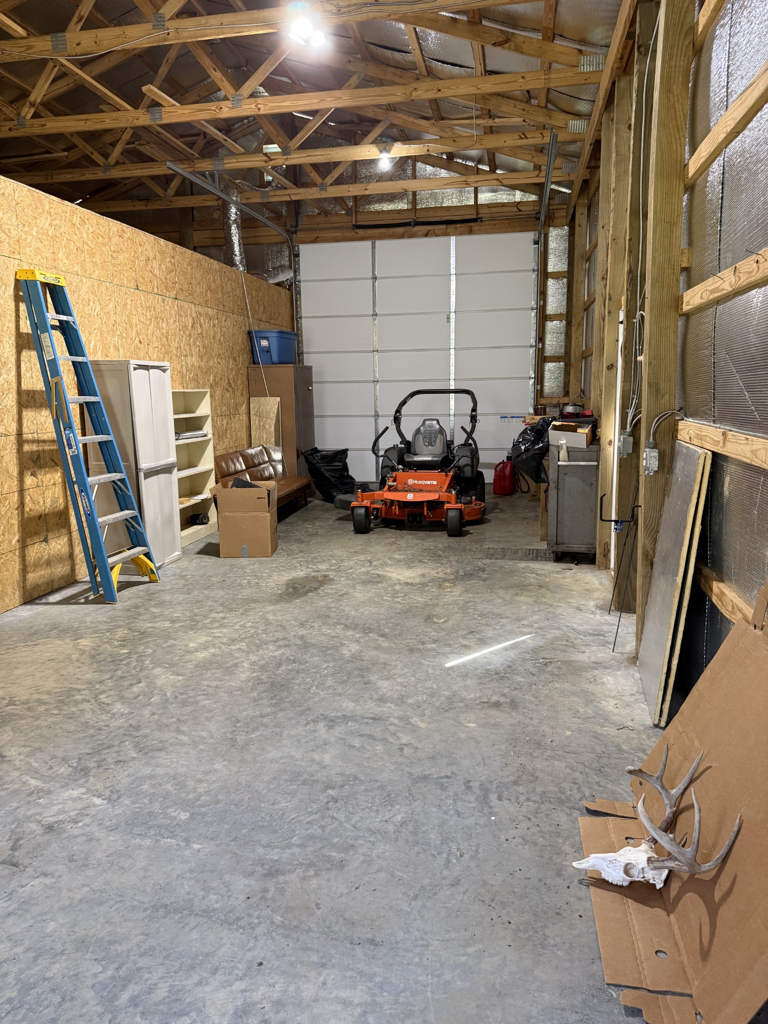 855 Lick Creek Road Hartsville, TN 37074 - Photo 32 of 76 a view of a garage with parked cars
