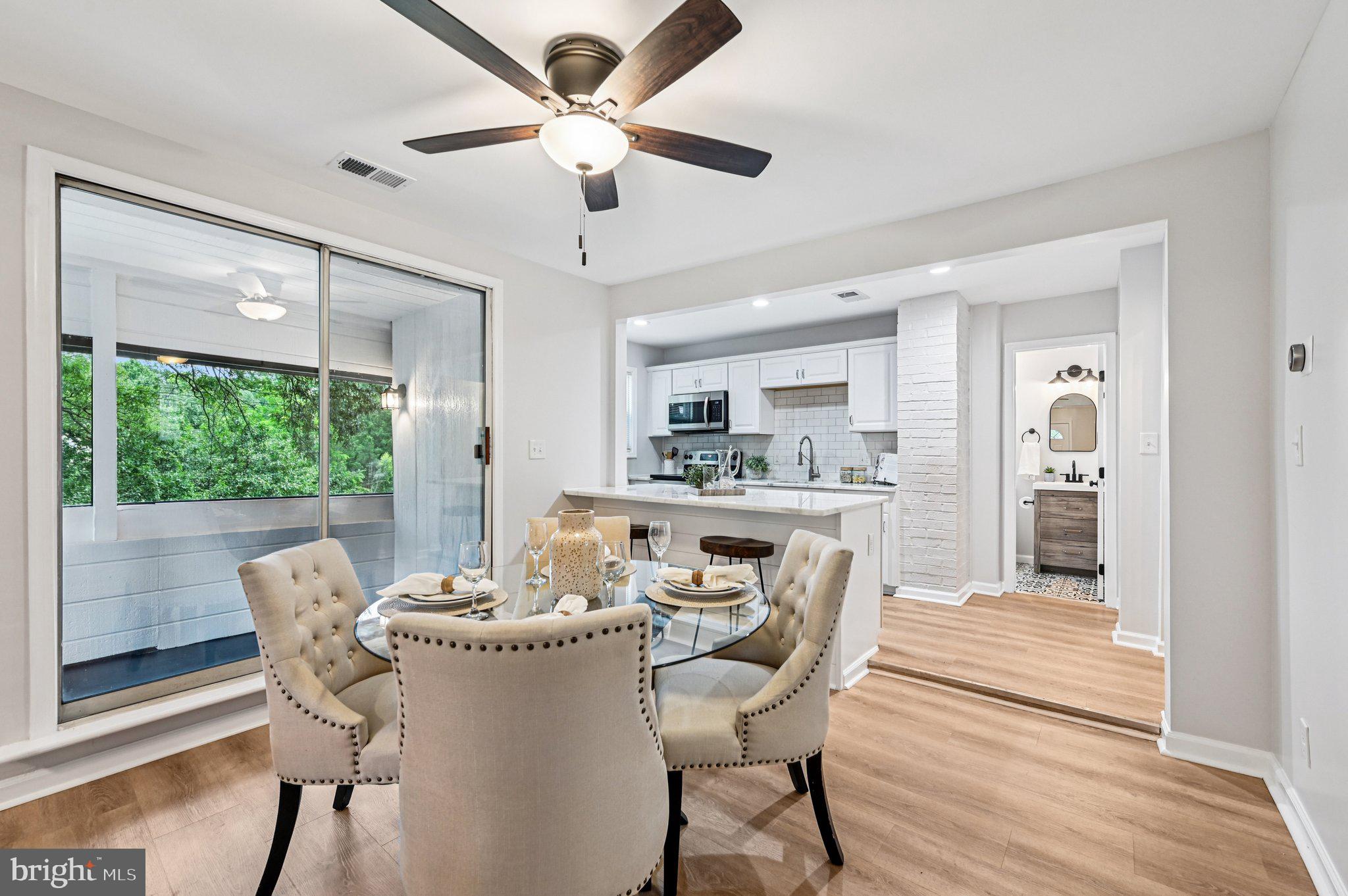 3569 Whiskey Bottom Road Laurel, MD 20724 - Photo 23 of 53 a dining room with furniture a chandelier and wooden floor