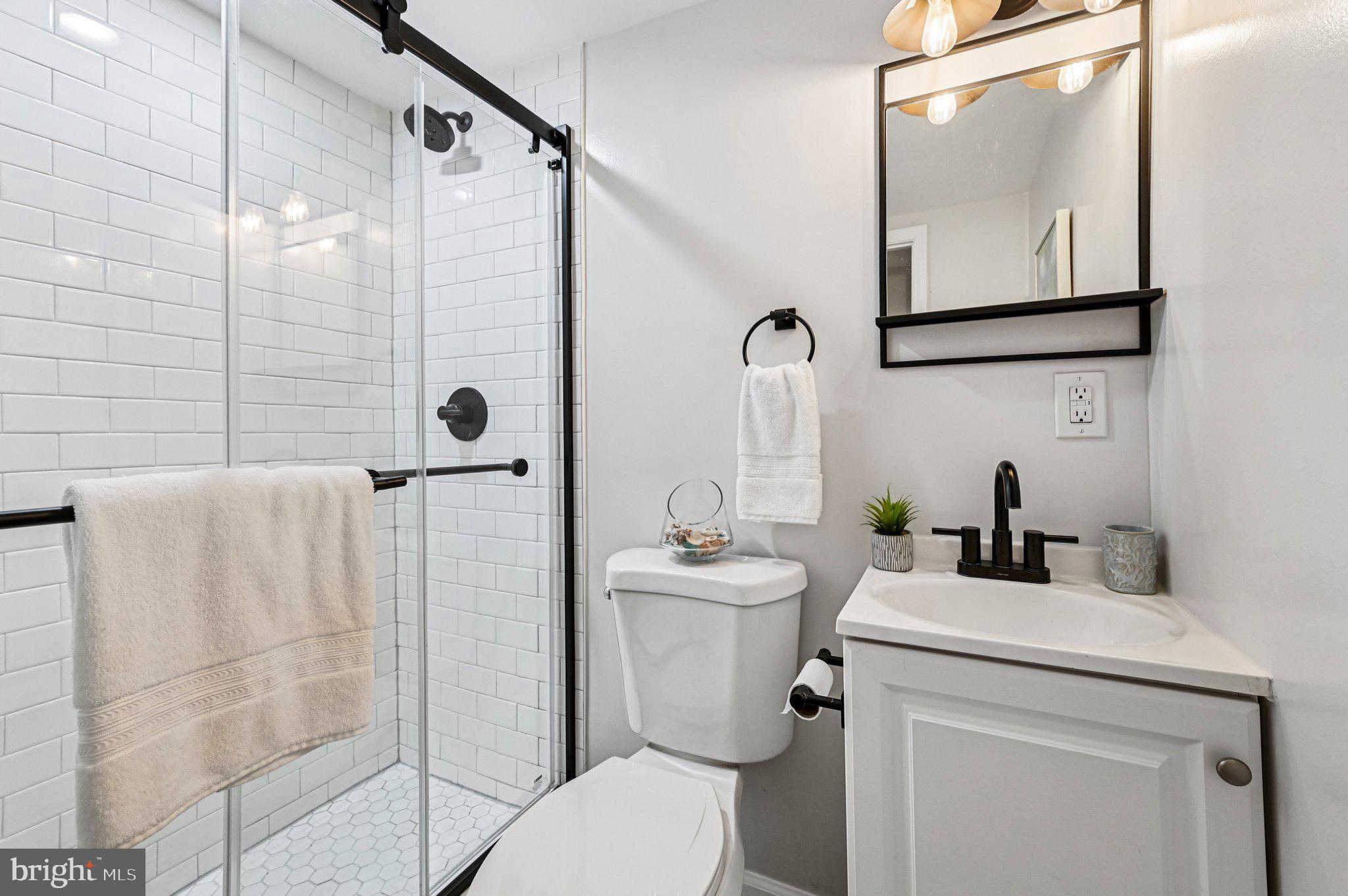 3569 Whiskey Bottom Road Laurel, MD 20724 - Photo 35 of 53 a bathroom with a toilet sink and mirror