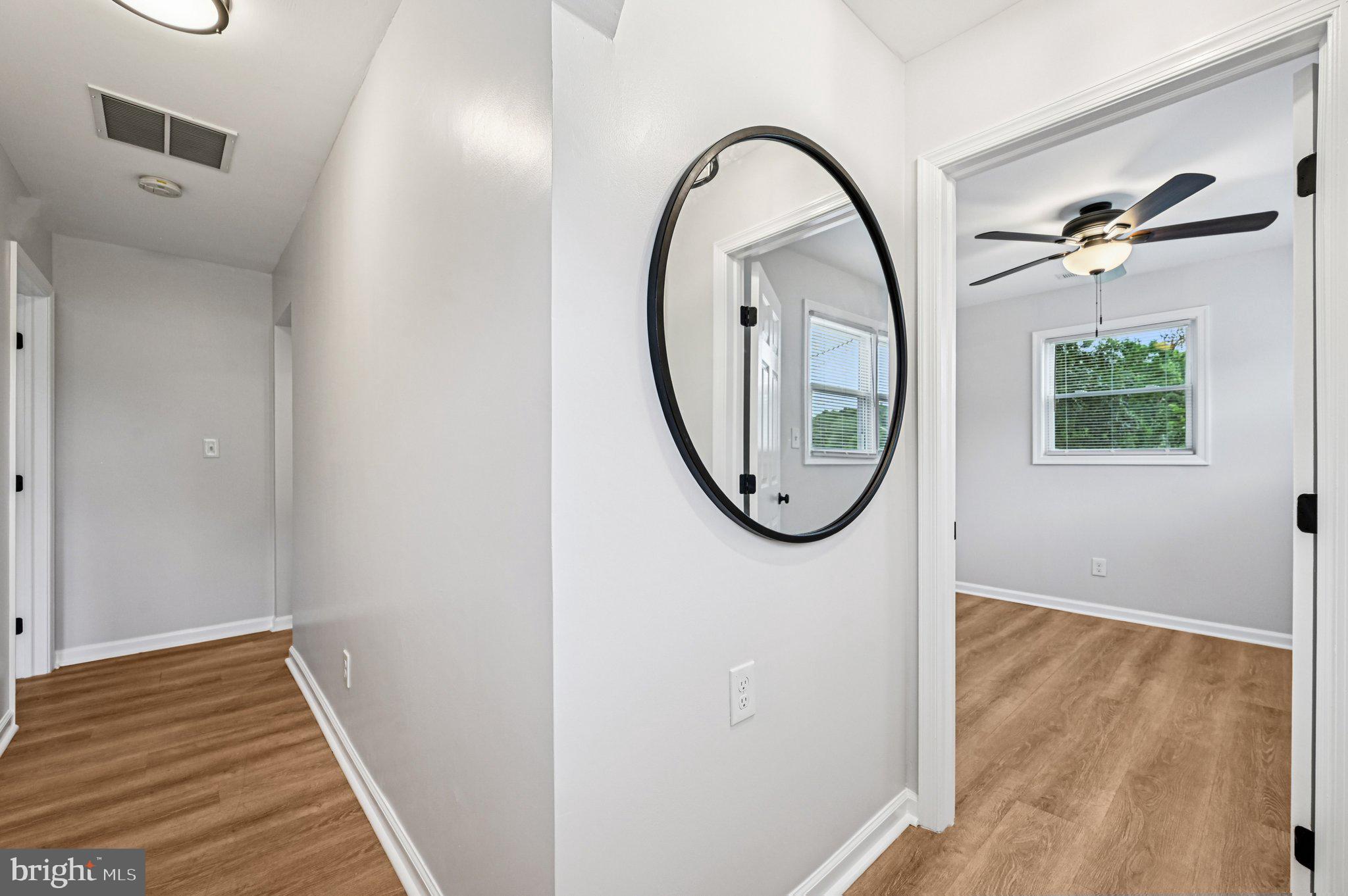 3569 Whiskey Bottom Road Laurel, MD 20724 - Photo 42 of 53 a view of a livingroom with wooden floor and a bathroom