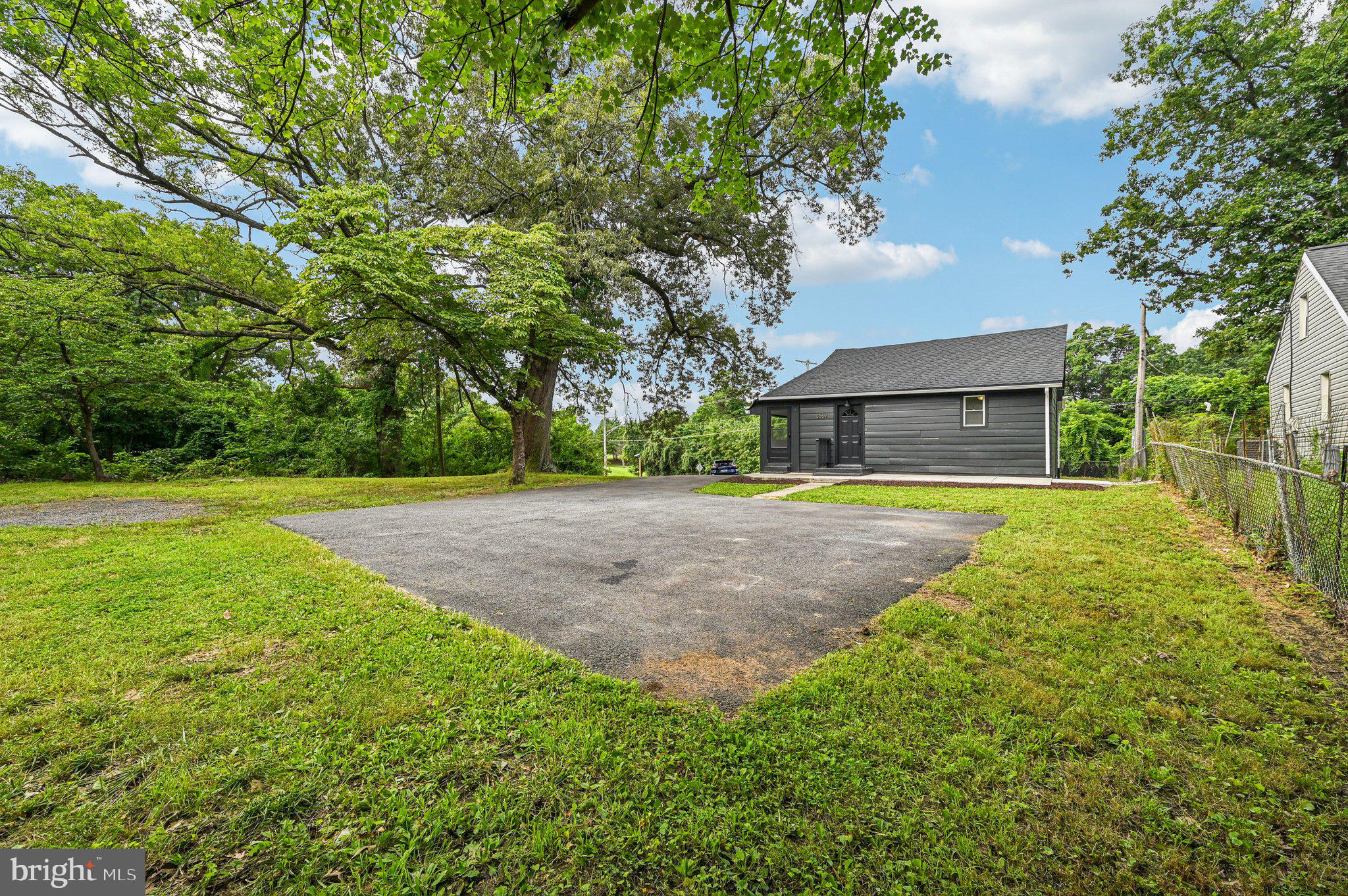 3569 Whiskey Bottom Road Laurel, MD 20724 - Photo 9 of 53 a view of a backyard with large trees