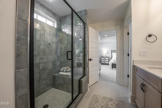 a bathroom with a shower and a sink