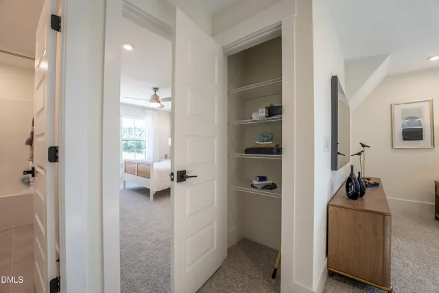 a view of a bedroom from a hallway