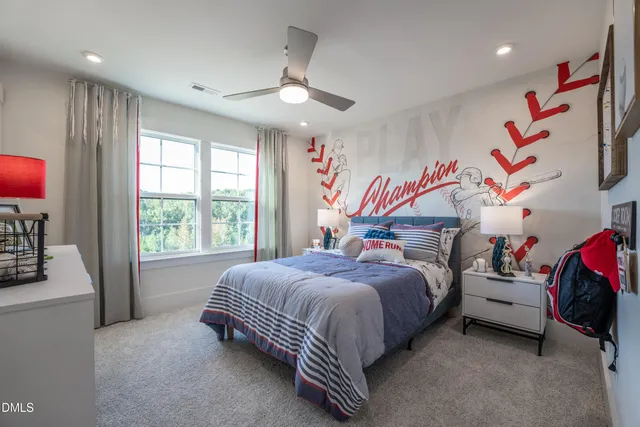 a bedroom with bed and a chandelier