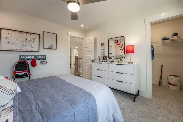 a bed room with a bed and a desk