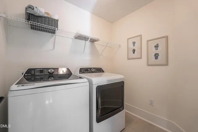a view of storage and utility room with washer and dryer
