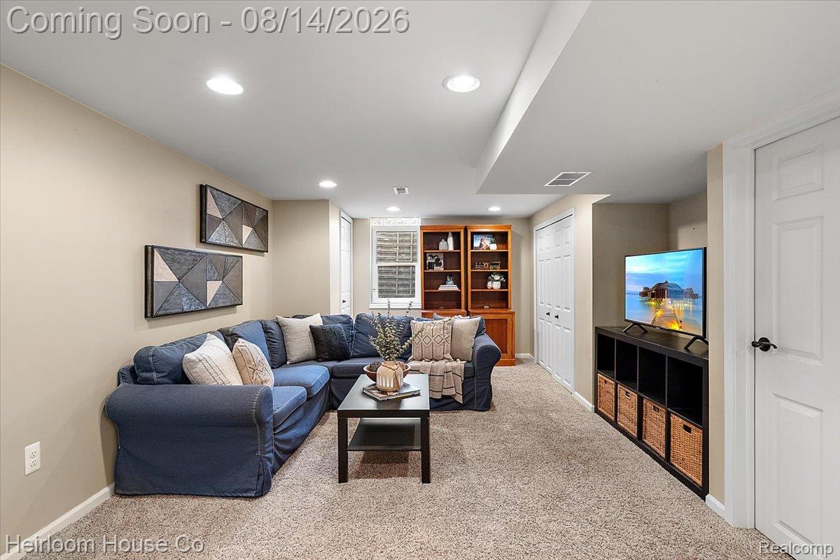 45697 Bryn Mawr Road Canton, MI 48187 - Photo 69 of 75 Carpeted recreation room featuring recessed lighting, a built-in wooden bookcase, and white paneled doors