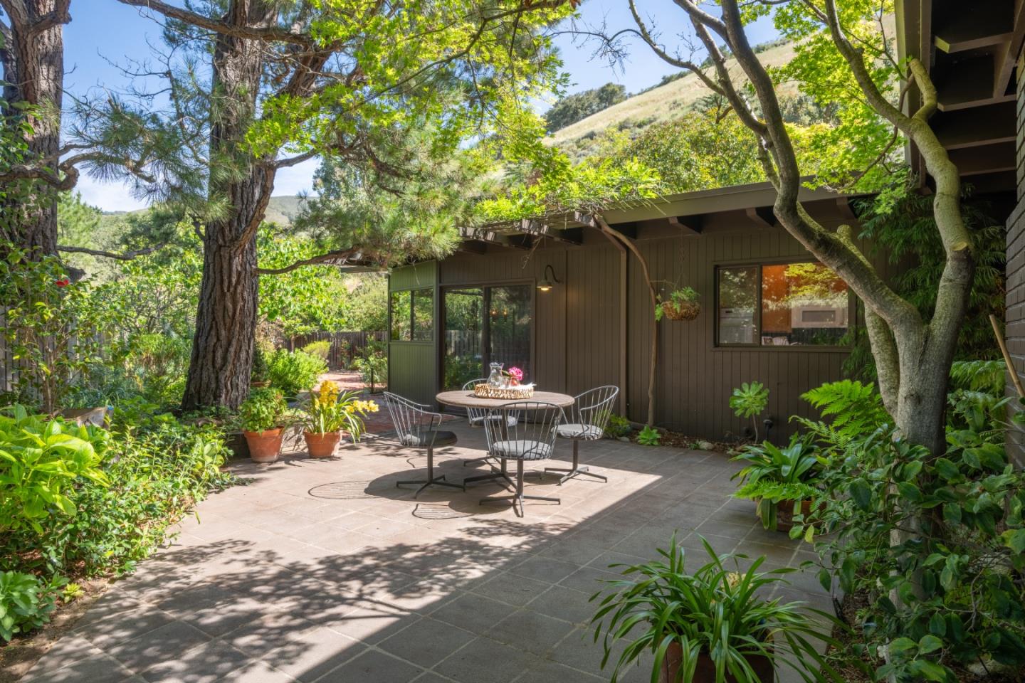 46 Middle Canyon Road Carmel Valley, CA 93924 - Photo 46 of 74 a view of a bench in the garden of a patio