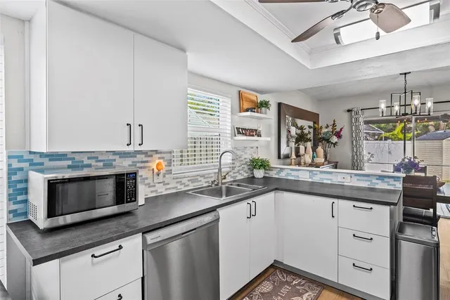a kitchen with a stove and a refrigerator