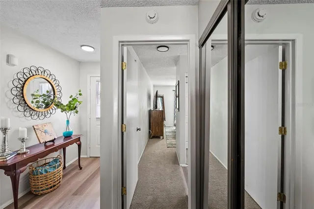 a spacious bathroom with a mirror a sink and a mirror