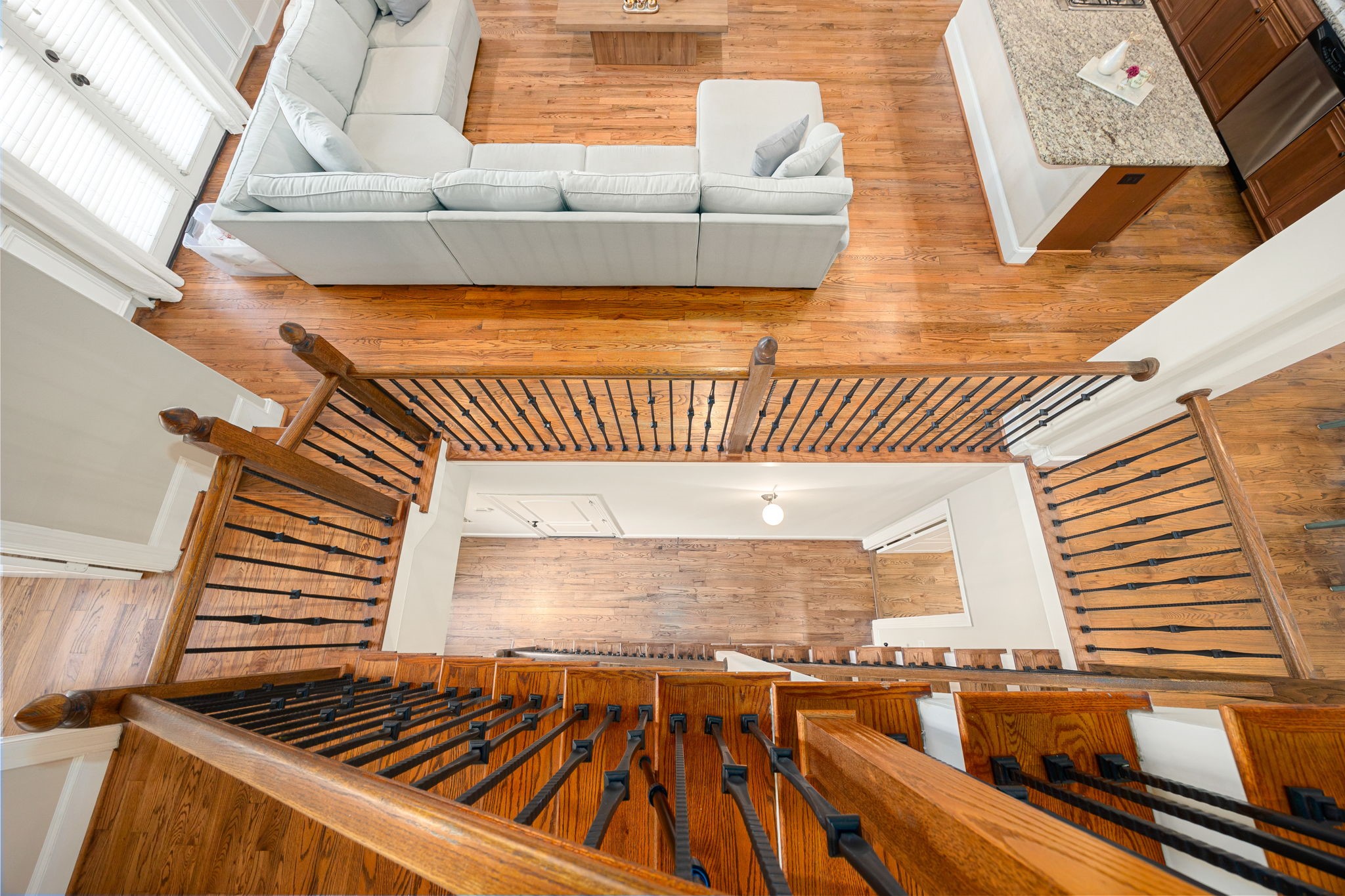 821 Lester Street Houston, TX 77007 - Photo 14 of 44 Elegant Iron and wood staircase anchor this elegant home!