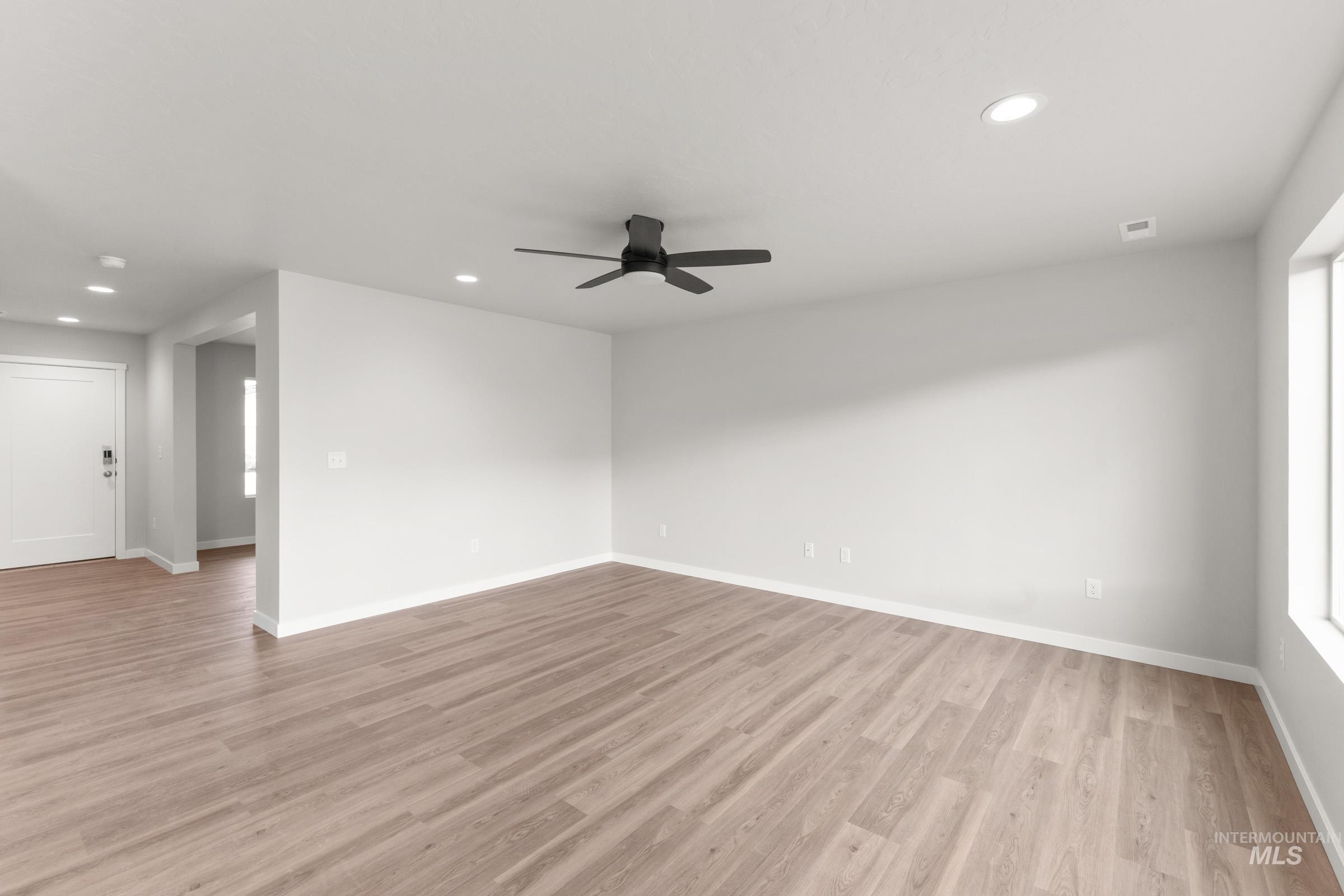 461 Waverly Avenue Middleton, ID 83644 - Photo 8 of 22 Empty room featuring recessed lighting, a ceiling fan, and light wood finished floors