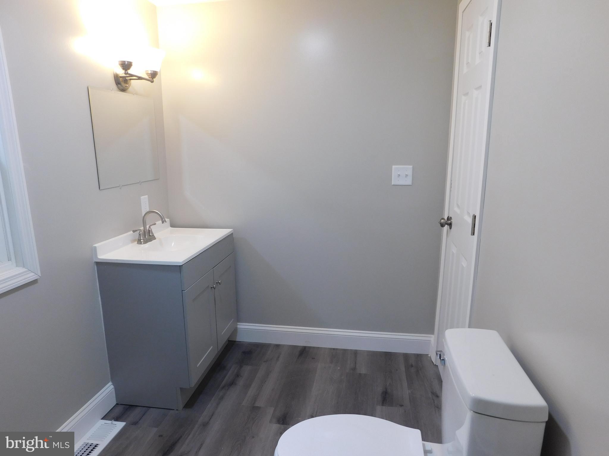 855 Shippy Road Manns Choice, PA 15550 - Photo 6 of 7 a bathroom with a sink and a mirror