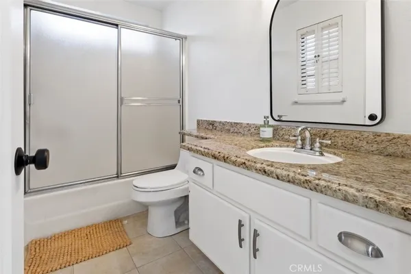 a swimming pool with outdoor seating and yard