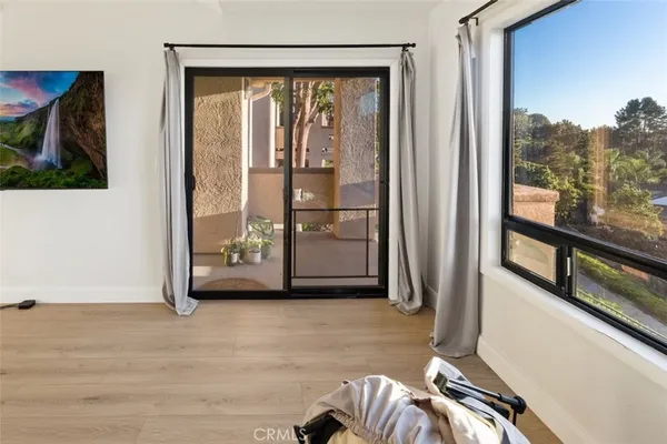 a kitchen with granite countertop a refrigerator and a sink