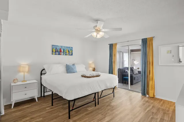 a bedroom with two beds and a window