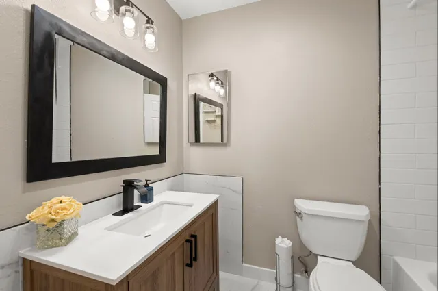 an aerial view of a house with outdoor space