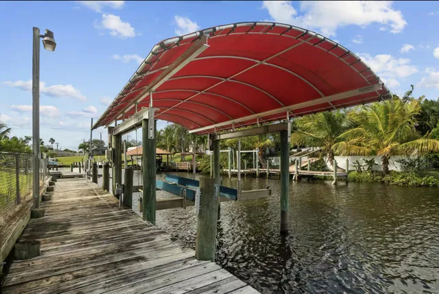 swimming pool view with a lake view