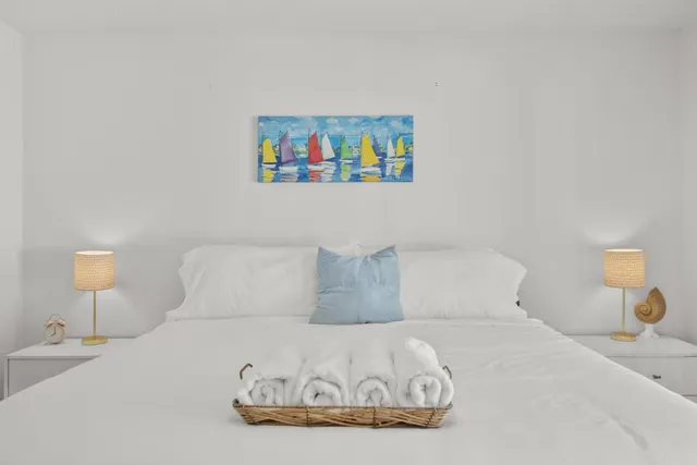 a bedroom with a bed and a table in it