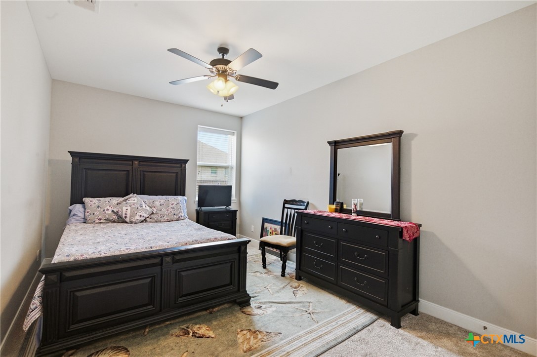 113 Terra Vista Ranch Road Victoria, TX 77904 - Photo 34 of 47 a bedroom with a bed and a dresser