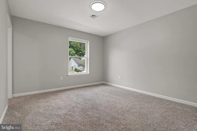 an empty room with windows and window