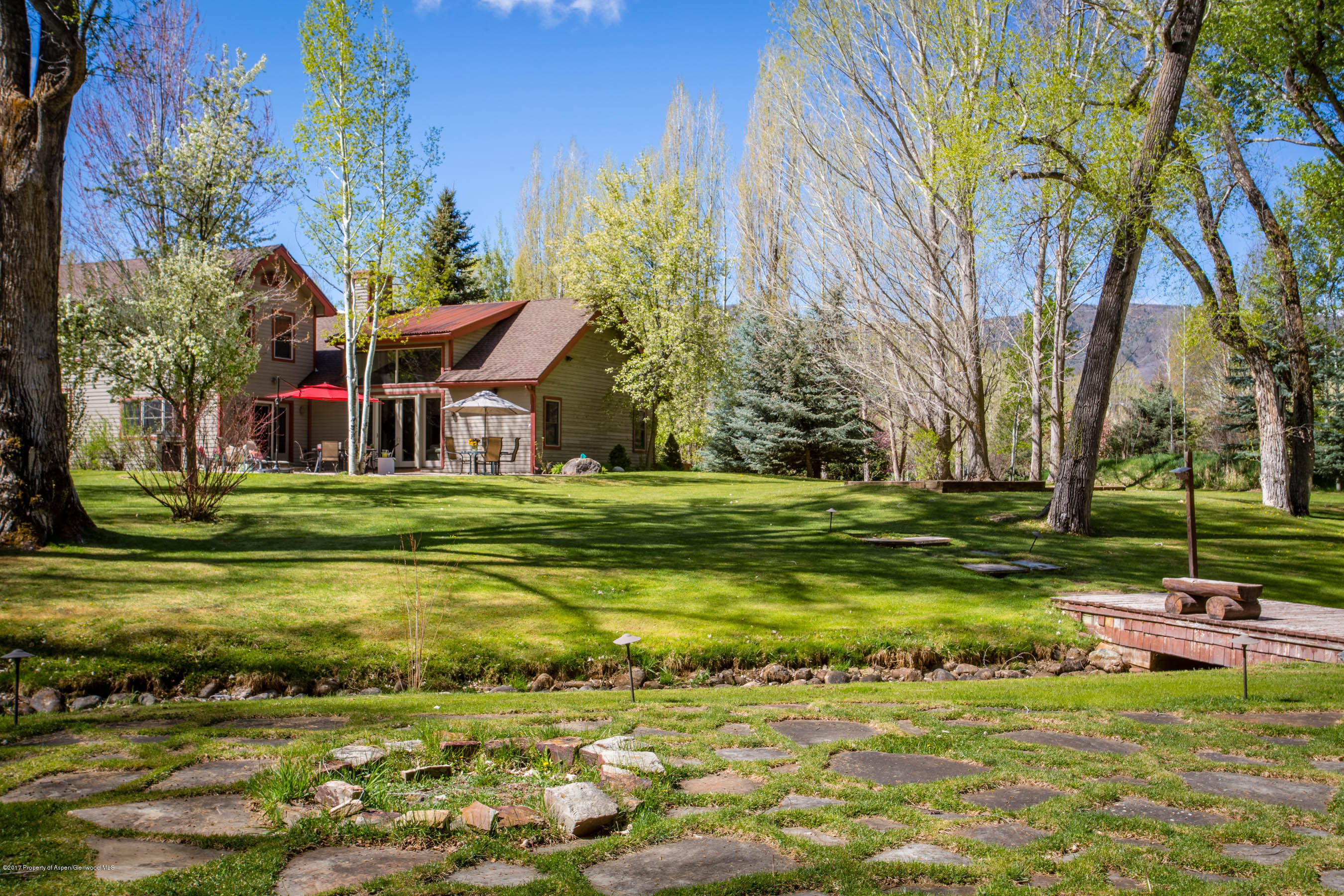 345 Lewis Lane Basalt, CO 81621 - Photo 19 of 26 a view of swimming pool with lawn chairs and plants