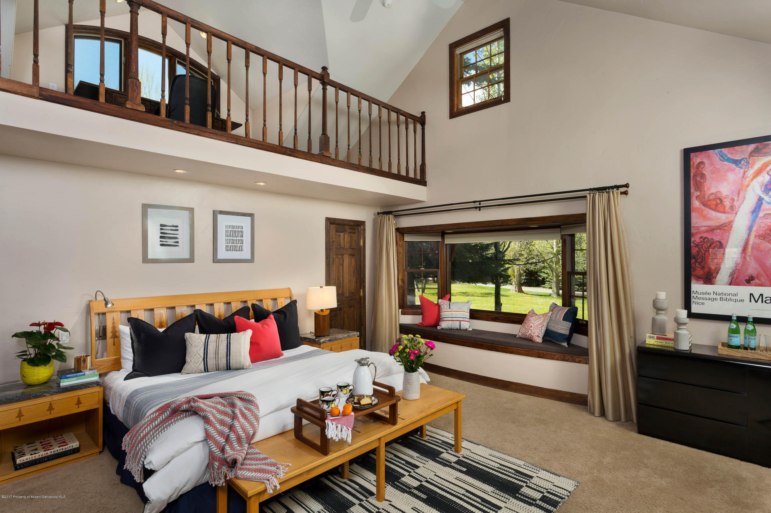345 Lewis Lane Basalt, CO 81621 - Photo 9 of 26 a bedroom with furniture and a large window