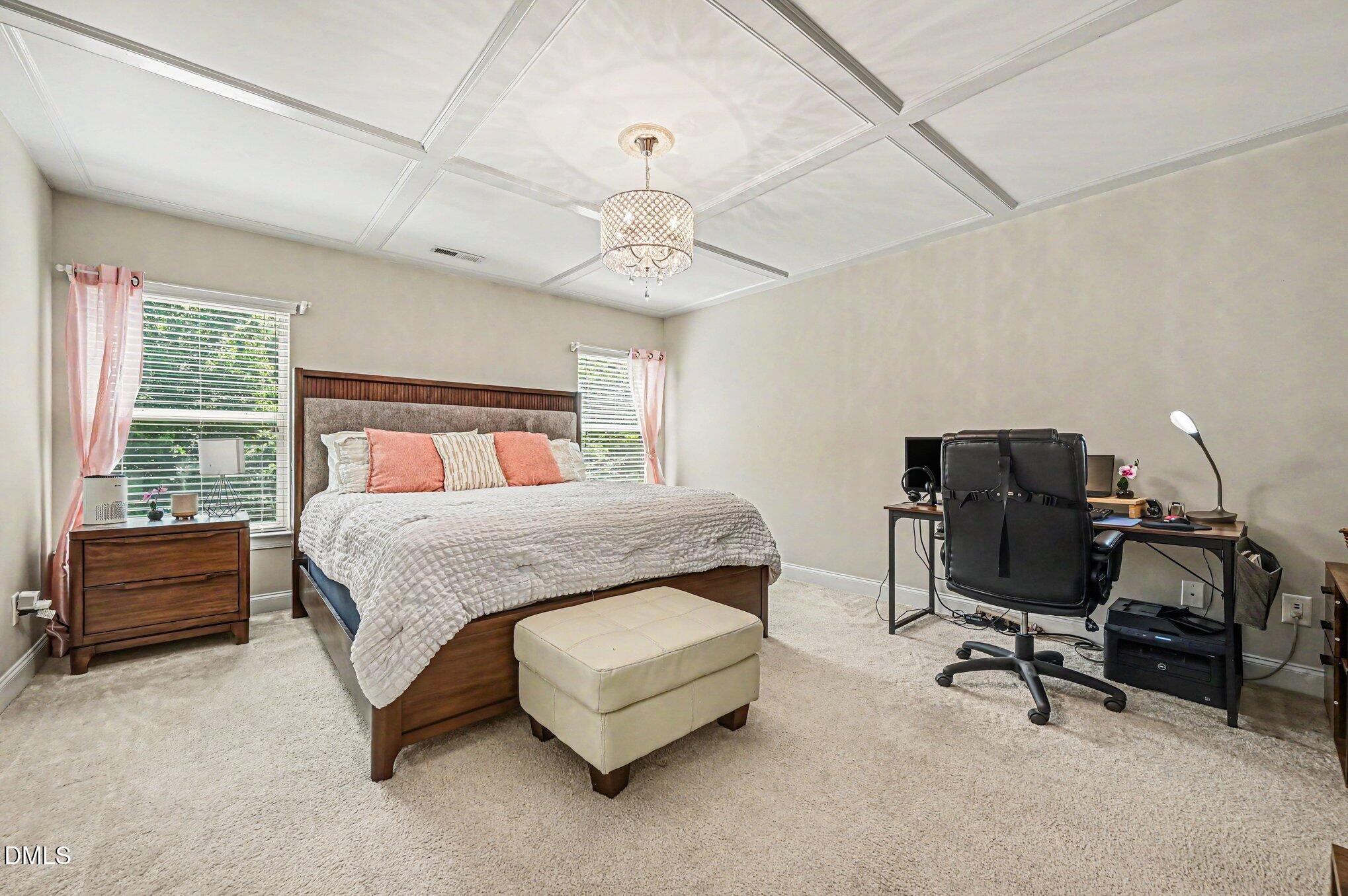 160 Token House Road Durham, NC 27703 - Photo 13 of 26 a bedroom with a bed chair and dresser