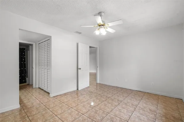 a view of an empty room with glass door