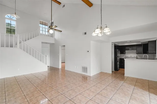 a view of a hallway with chandelier and chandelier